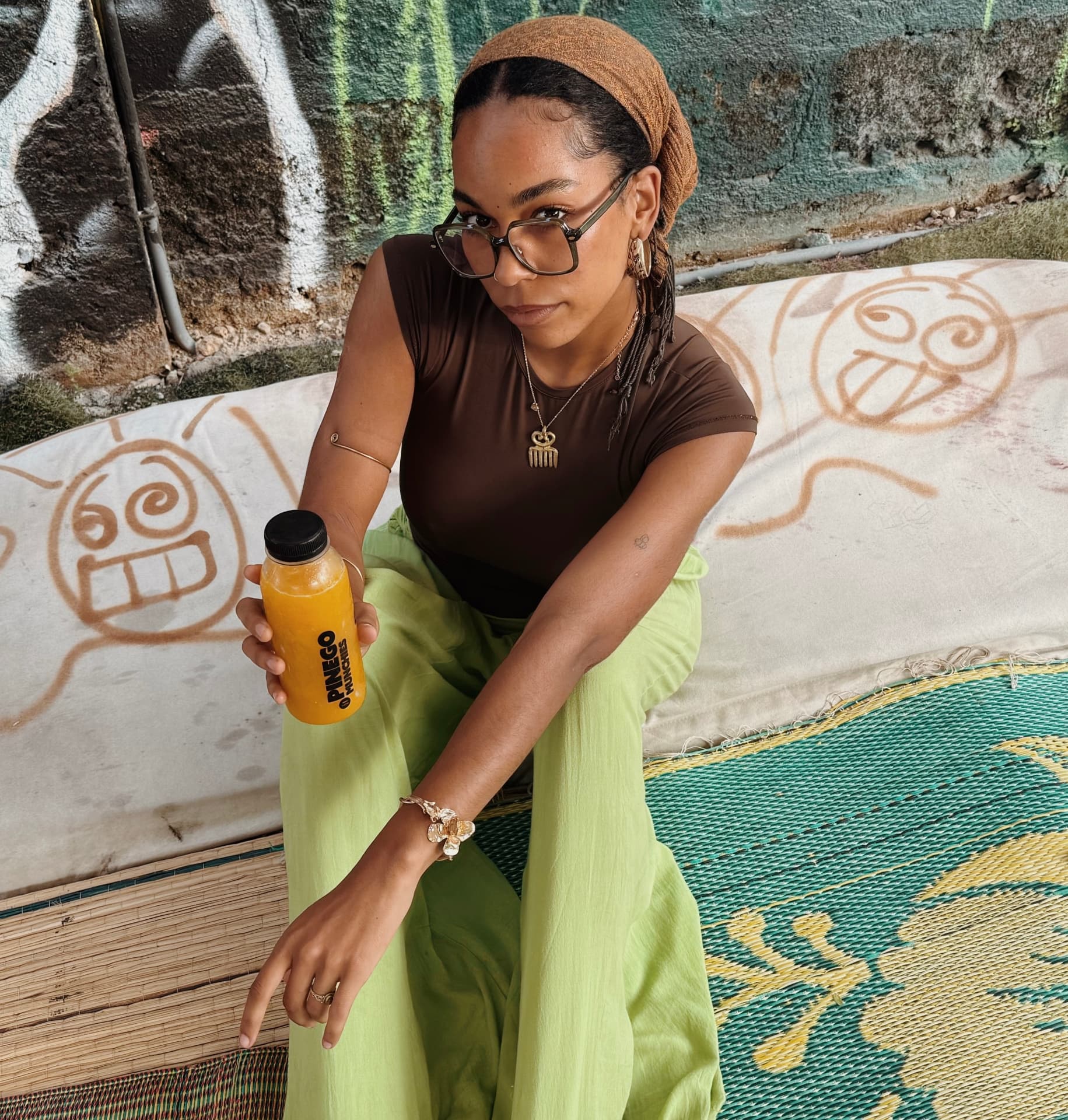 Customer holding a bottle of Pinego Munchies juice